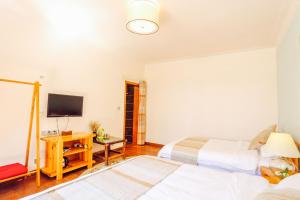 Postel nebo postele na pokoji v ubytování Log Cabin