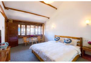 Postel nebo postele na pokoji v ubytování Log Cabin