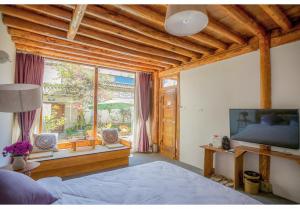 TV a/nebo společenská místnost v ubytování Log Cabin