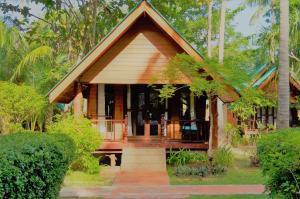 a small house in the middle of a forest at Sayang Beach Resort Koh Lanta in Ko Lanta