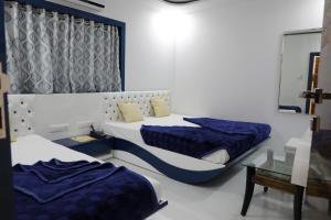 Postel nebo postele na pokoji v ubytování Hotel Pearl