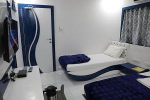 Postel nebo postele na pokoji v ubytování Hotel Pearl