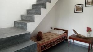 Postel nebo postele na pokoji v ubytování Adams Wood House Ayurveda Homestay Kochi
