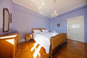 Postel nebo postele na pokoji v ubytování CAISA Classic Beachfront Apartment