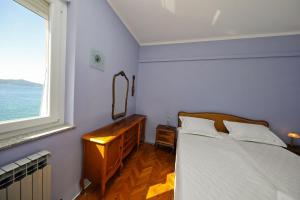 Postel nebo postele na pokoji v ubytování CAISA Classic Beachfront Apartment