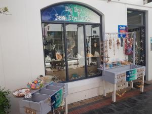 a big boy sea shells shop with a window at 180 Eden on the Bay, Big Bay in Big Bay
