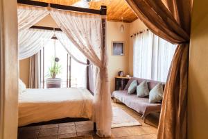 מיטה או מיטות בחדר ב-Chameleon Backpackers & Guesthouse
