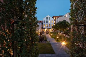 a view of a street at night with buildings at Hotel Hafen Flensburg in Flensburg