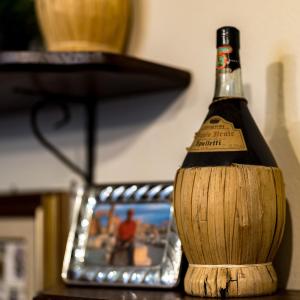 a bottle of wine sitting on top of a table at La Speranza Hotel Grazzini in Rufina