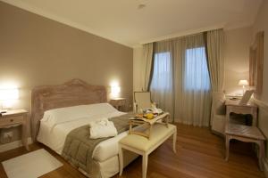 Postel nebo postele na pokoji v ubytování Hotel Antico Mulino