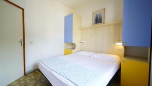 A bed or beds in a room at Appartamento Guido Reni