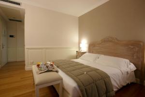 Postel nebo postele na pokoji v ubytování Hotel Antico Mulino