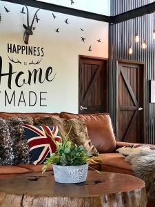 a living room with a couch and a table at Stella Moonlight Khaoyai in Pong Talong