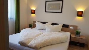 Posteľ alebo postele v izbe v ubytovaní Alpenappartement Sonne + 22 fotografií