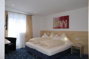 Postel nebo postele na pokoji v ubytování Hotel-Restaurant Steuermann