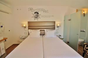 Voodi või voodid majutusasutuse Villa Ana Margarida Hotel toas