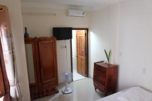 a room with a room with a refrigerator and a table at Moon house tropical garden - Valentine in Nha Trang