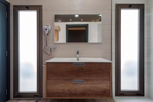 Koupelna v ubytování Apartamentos NataLis + 37 fotografií
