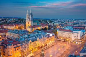 an aerial view of a city at night at Main Square Oval Apartment in Zagreb