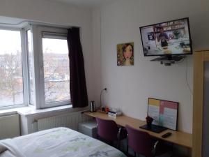 TV a/nebo společenská místnost v ubytování Hotel Baan