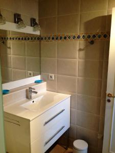 a bathroom with a sink and a toilet at nivelle in Saint-Jean-de-Luz