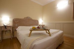 Postel nebo postele na pokoji v ubytování Hotel Antico Mulino