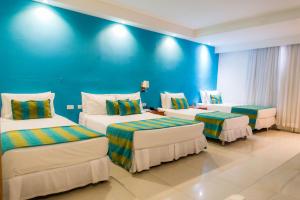 Postel nebo postele na pokoji v ubytování Hotel Bocagrande By GEH Suites
