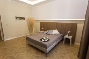 Postel nebo postele na pokoji v ubytování Le Affacciate Bruzie Home Guest House