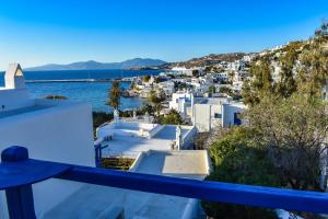 a view of a city from the balcony of a house at Villa Francesca in Mýkonos City