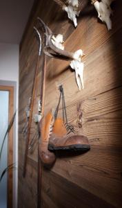a pair of shoes hanging on a wall at Appartementhaus Mountain Room in Altenmarkt im Pongau
