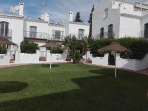 A garden outside Residencial los Pinos 3