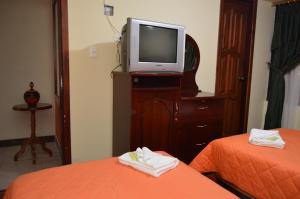 Postel nebo postele na pokoji v ubytování Balcones del Río Hotel