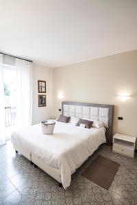 Postel nebo postele na pokoji v ubytování Hotel Le Vigne di Corvino