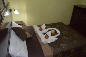 Postel nebo postele na pokoji v ubytování Balcones del Río Hotel