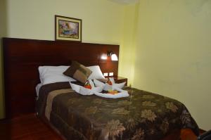 Postel nebo postele na pokoji v ubytování Balcones del Río Hotel