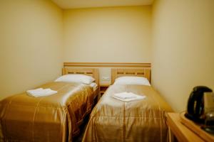 Postel nebo postele na pokoji v ubytování Hotel Akademie a depandance Vila Jarmila