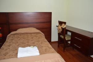 Postel nebo postele na pokoji v ubytování Balcones del Río Hotel