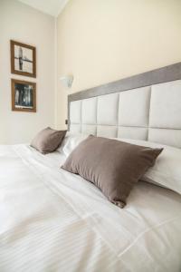 Postel nebo postele na pokoji v ubytování Hotel Le Vigne di Corvino