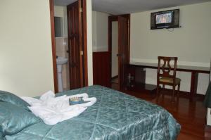 Postel nebo postele na pokoji v ubytování Balcones del Río Hotel
