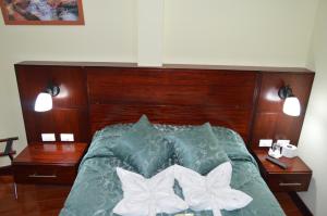 Postel nebo postele na pokoji v ubytování Balcones del Río Hotel