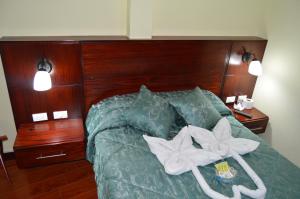 Postel nebo postele na pokoji v ubytování Balcones del Río Hotel