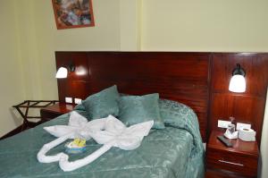 Postel nebo postele na pokoji v ubytování Balcones del Río Hotel