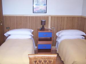 Postel nebo postele na pokoji v ubytování Hotel Ristorante La Torretta