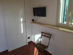 Televiisor ja/või meelelahutuskeskus majutusasutuses Karrua House - Magnolia Room