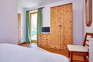 Televízia a/alebo spoločenská miestnosť v ubytovaní Ferienwohnung Haus Leonard