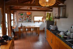 a kitchen with a table and a dining room at Luckydaisy Buffalo House in Sapa