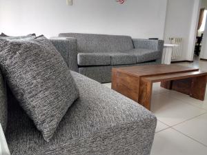 a living room with a couch and a coffee table at Apartamentos 44 in La Plata
