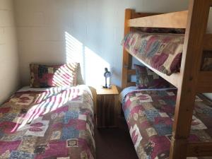 
A bunk bed or bunk beds in a room at Country Cottages of Bridgetown
