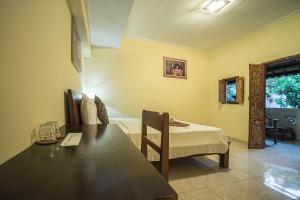 Postel nebo postele na pokoji v ubytování Tegar Guest House Ubud