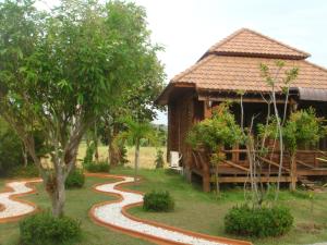 a house with a winding path in front of it at Indie House @ Maerim in Mae Rim